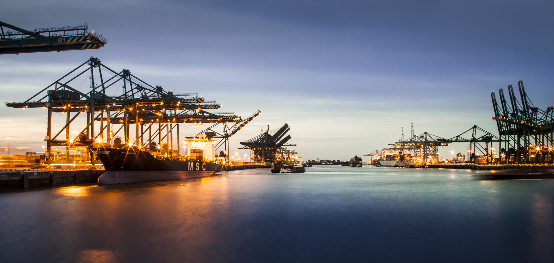 Port of Antwerp at dusk — international trade and logistics